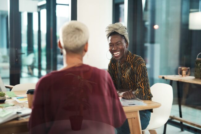 Sharing ideas is vital to success One on one meeting with two workers.