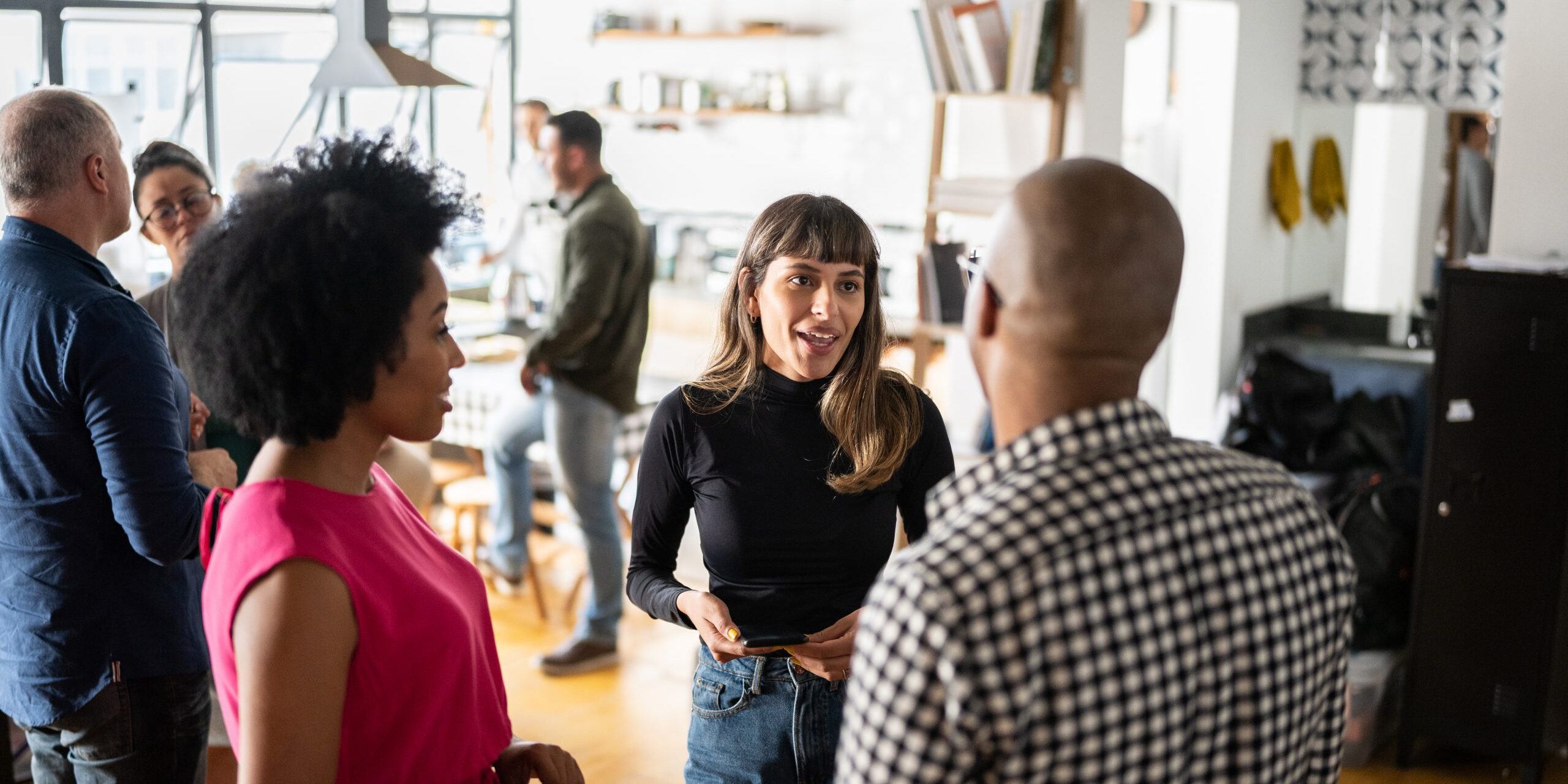 Colleagues talking after work at a coworking