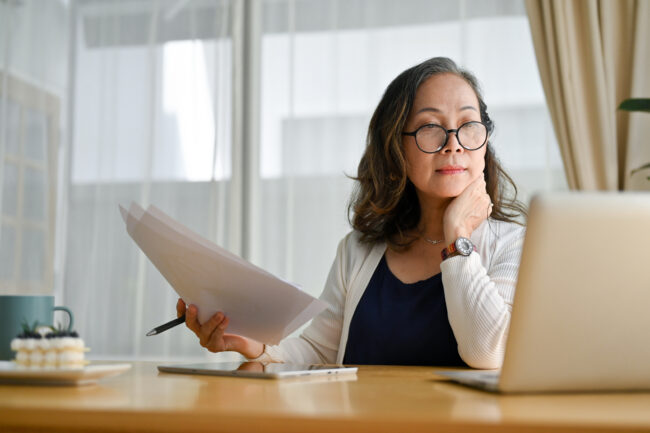 Woman going over compliance issues. Woman going over compliance issues.