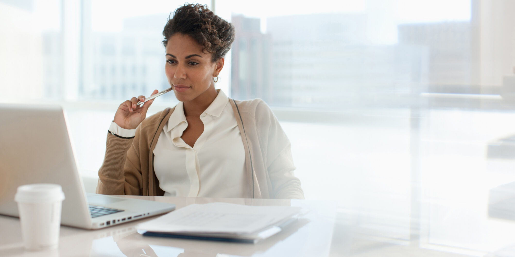 Woman filling out paperwork for compliance. Woman filling out paperwork for compliance.