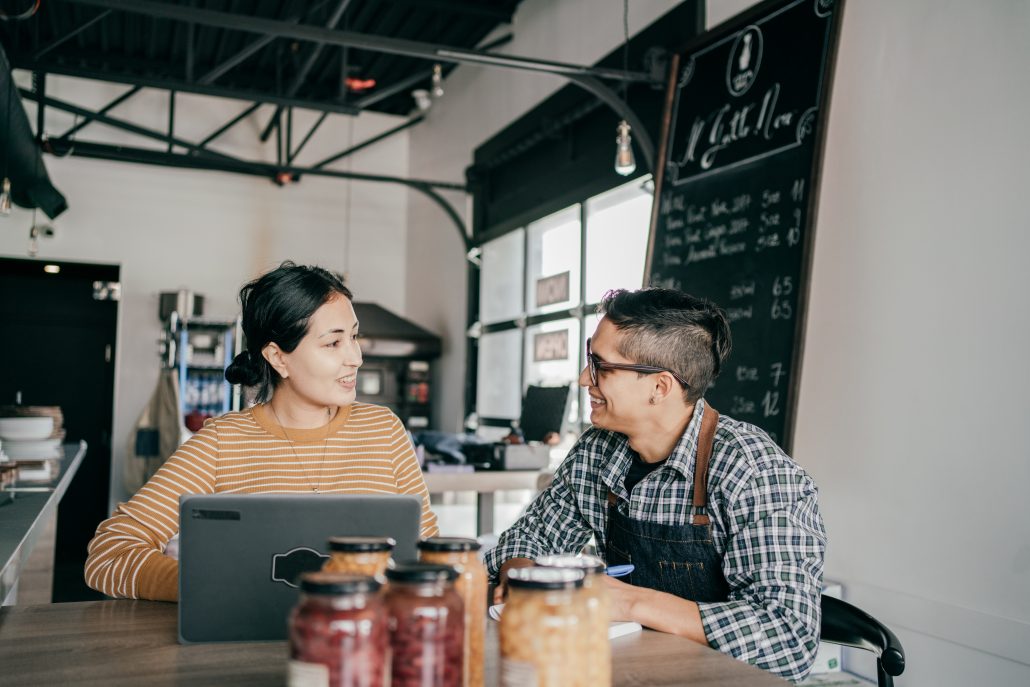 Workers having a respectful conversation about business.