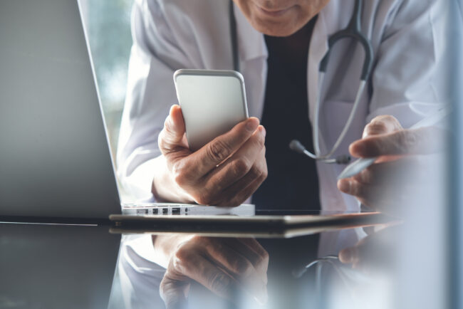 Doctor working on laptop computer