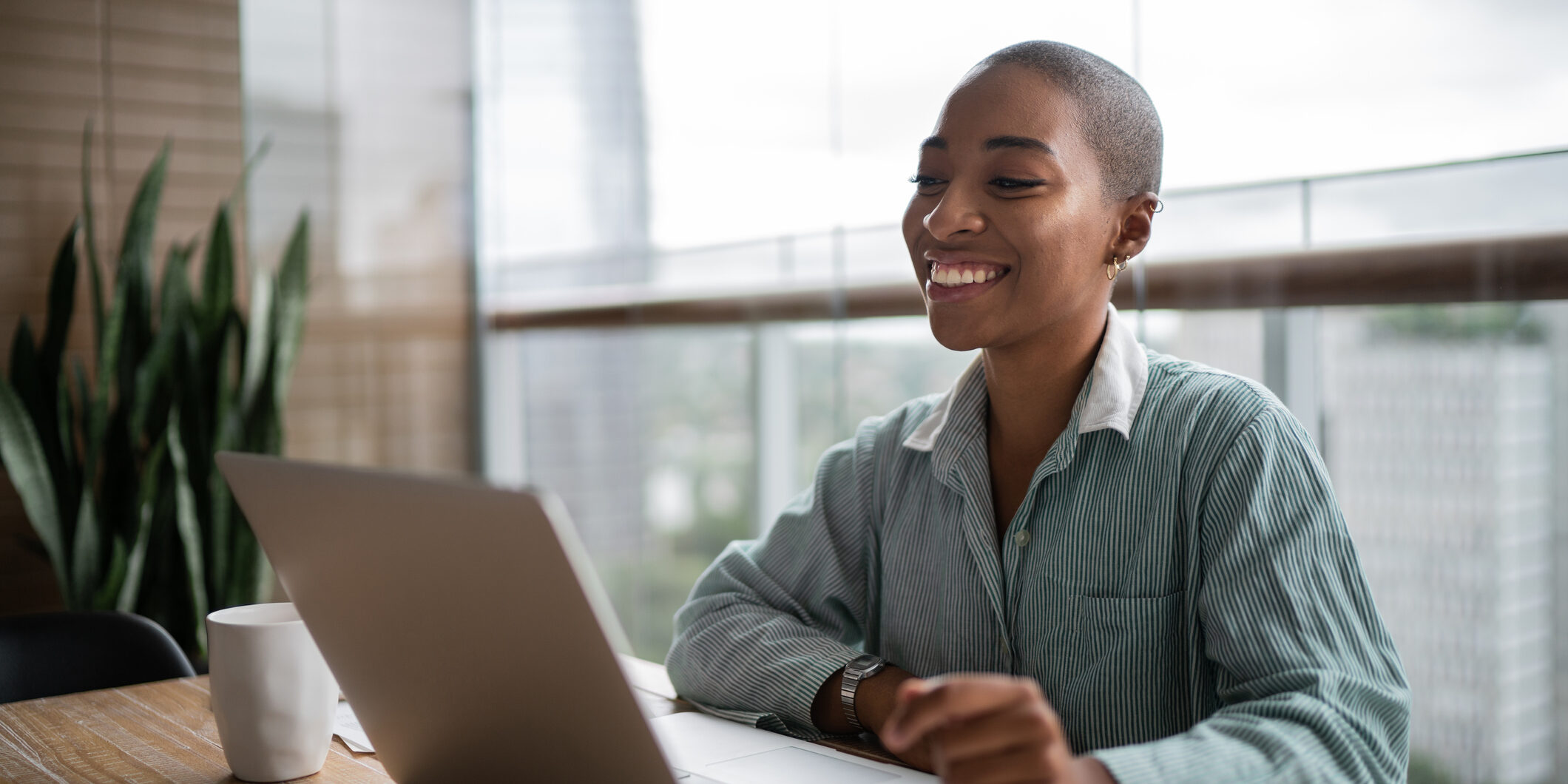 Young woman working and doing a virtual business meeting on laptop at home Young woman working and doing a virtual business meeting on laptop at home