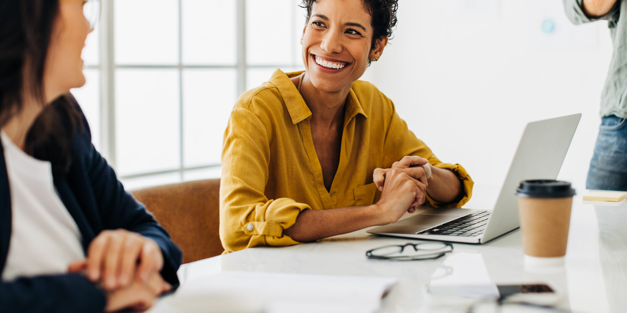 Business woman talking to her colleague during a meeting in a boardroom
