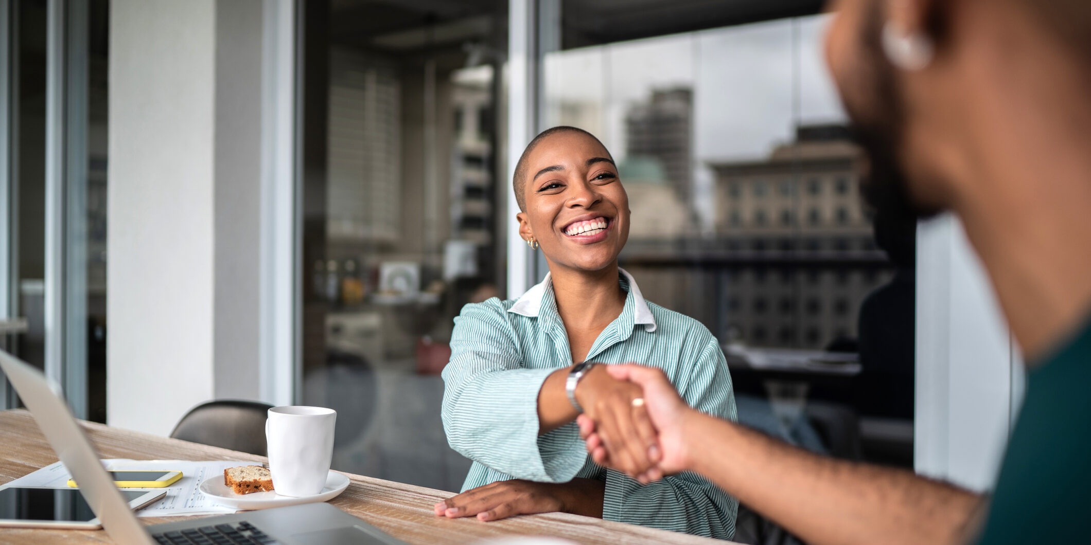 Interview handshake between two people. Interview handshake between two people.