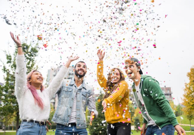 Group of young students bonding outdoors