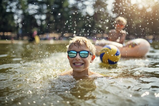 Little boys enjoying playing in lake