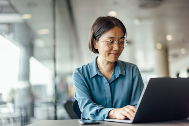 Confident asian woman, trying to help her customers