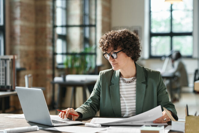 Businesswoman working on laptop at office