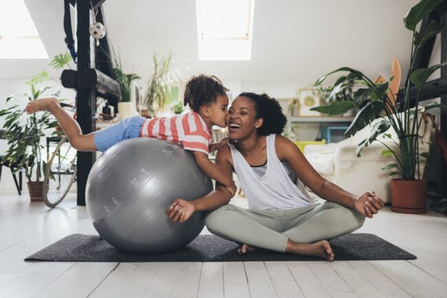Mother And Daughter Exercising