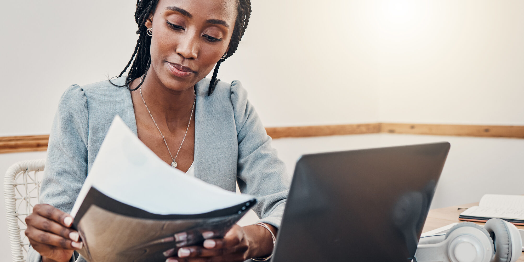 Black woman with business documents, small business entrepreneur working on strategy and planning online marketing. Learning startup industry vision, laptop for advertising company and technology job