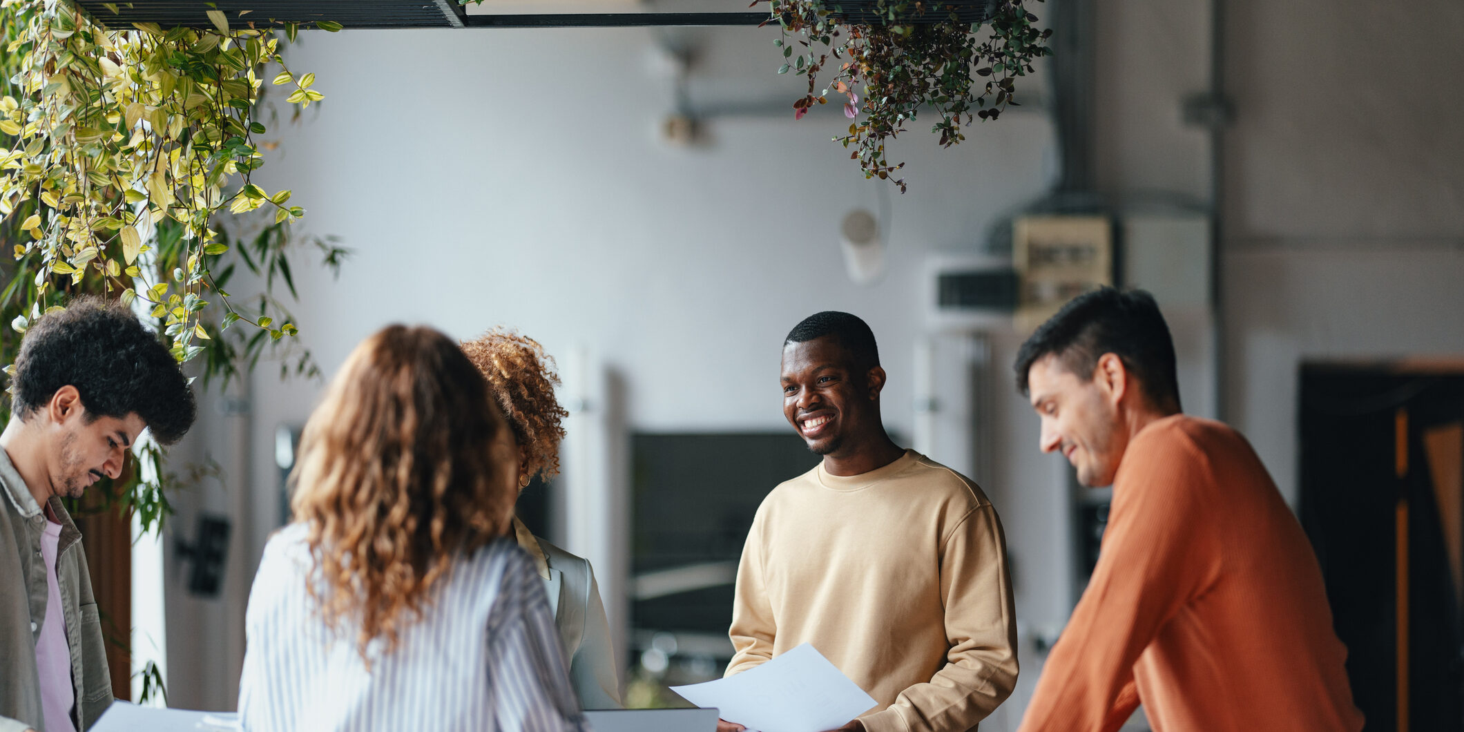 A Group Of Happy Multiethnic Businesspeople Working Together In The Office