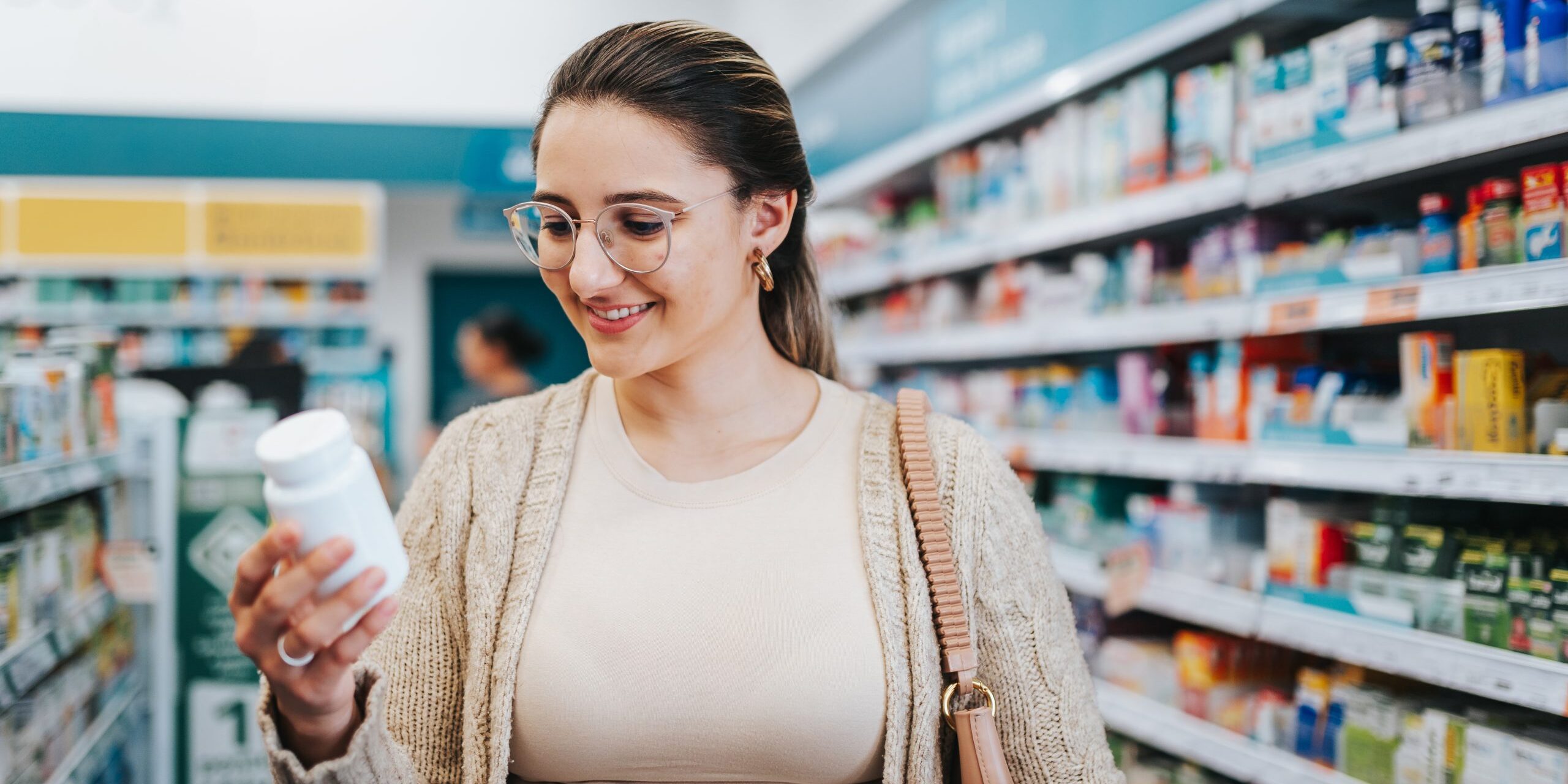 Woman choosing supplements at the pharmacy