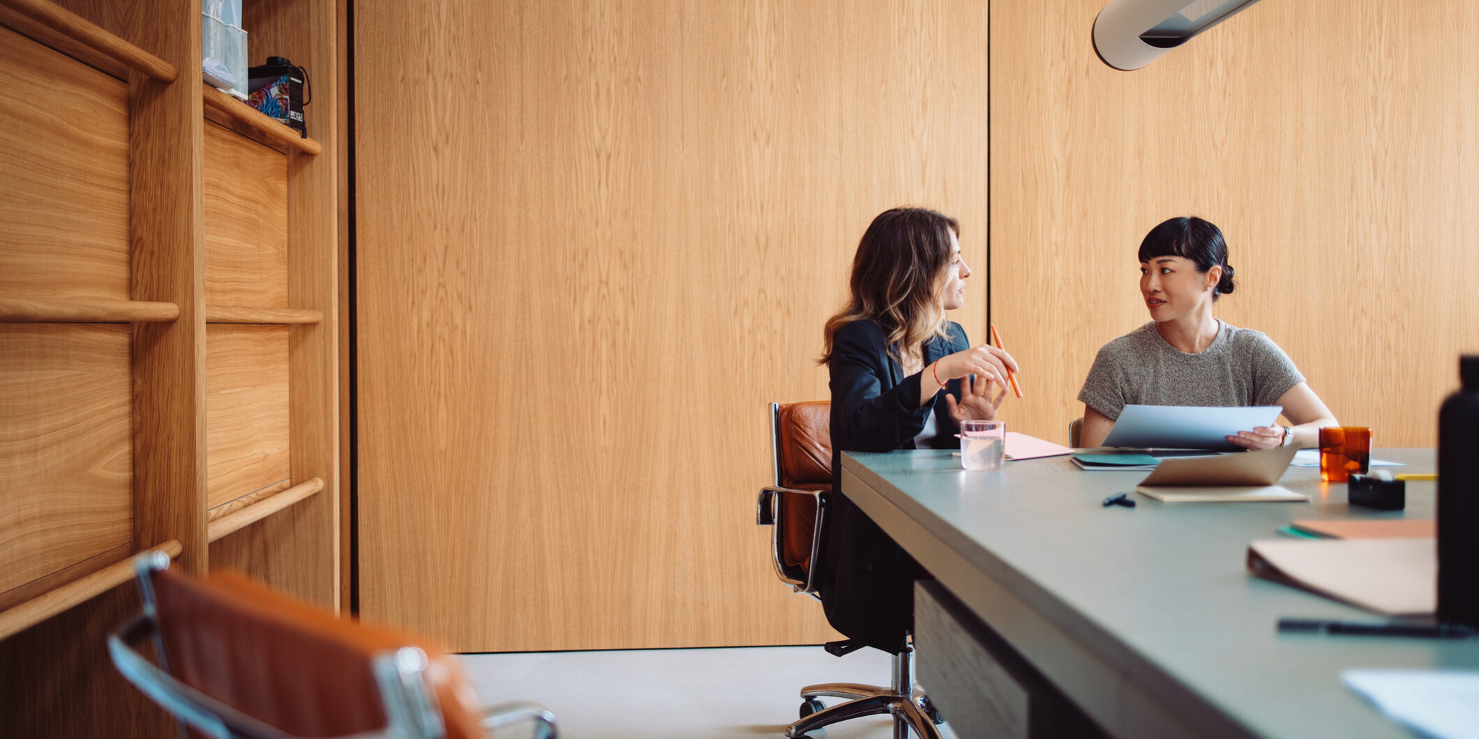 Two Businesswomen Having a Meeting in a Modern Office